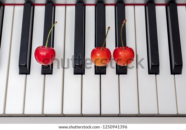 Piano Chord Shown By Cherries On Stock Photo Edit Now