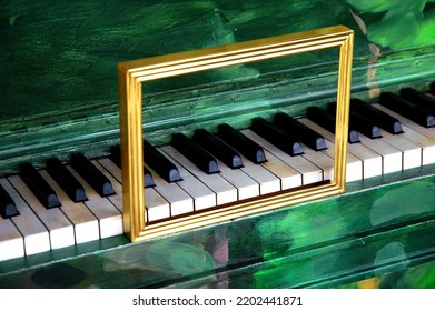 Piano With Gold Picture Frame In Front Of Octave