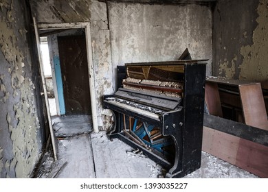 Piano Inside an abandoned house in Chernobyl, Ukraine 