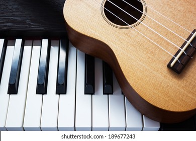 Piano key and ukulele. Art and music background. Top view. Classic and simple style. - Powered by Shutterstock