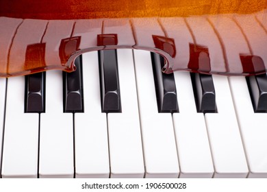 Piano keys are reflected in the violin fragment