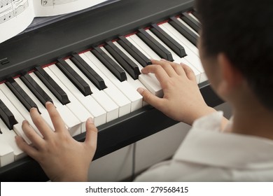 Piano Lesson, Asian Boy Kid Activity Playing Piano With Notes