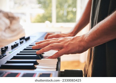 Piano, man and hands on keys for music, creative talent and skills in home studio. Closeup, musician and playing synthesizer keyboard for audio performance, sound artist and learning instrument notes - Powered by Shutterstock