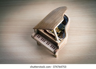 Piano Music Box On Wooden Background