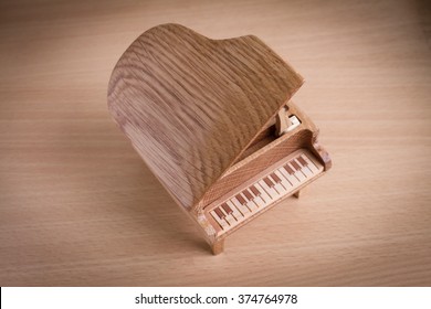 Piano Music Box On Wooden Background