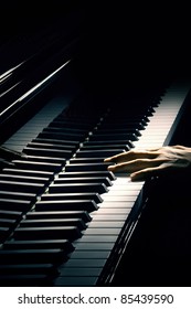 Piano Music Pianist Hand Playing. Musical Instrument Grand Piano Details With Performer Hands On Black Background