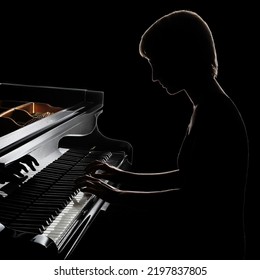 Piano Player. Pianist Concert Playing Grand Piano. Classical Musician In Darkness Isolated On Black