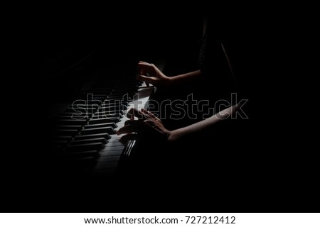 Piano player. Pianist hands playing grand piano keys. Music instrument close up