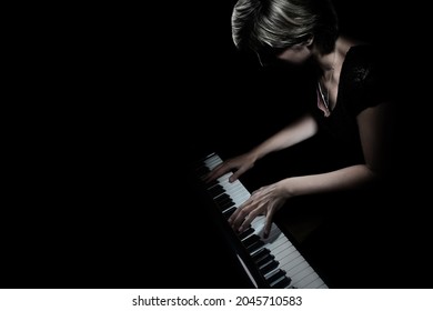 Piano Player. Pianist Woman Playing Grand Piano Concert. Classical Musician In Darkness