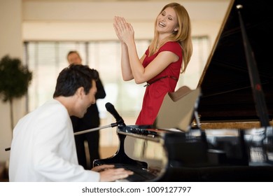 Piano player and singing girl - Powered by Shutterstock