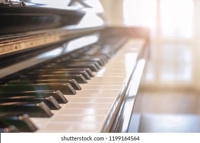 The piano was set up in the music room by the windows in the morning to allow the pianist to rehearse before the classical piano performance in celebration of the great businessman's success - Powered by Shutterstock