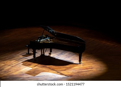 Piano Standing On Empty Stage