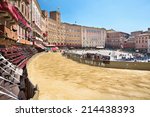 Piazza del Campo in the preparation of the sandy substrate for the place of the Palio horse race, with the Public Palace, Siena, Tuscany, Italy