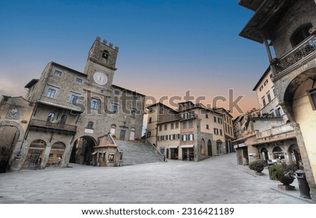 Piazza della Repubblica - the main square of the town of Cortona with a stormy clouds 