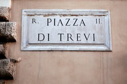 Piazza Di Trevi Sign On Building Wall In Rome, Italy