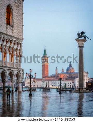 Piazza San Marco at dusk, view on venetian lion and san giorgio maggiore, Vinice, Italy