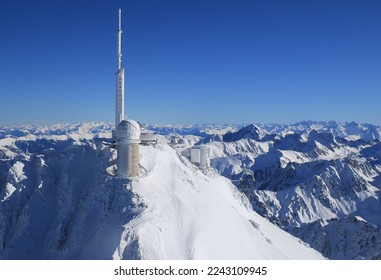 Pic du midi seen from the air on a sunny day with beautiful blue skies after several days of snowfal