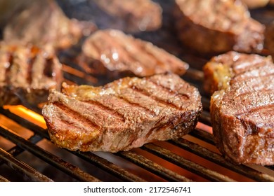 Picanha barbecue roasted over hot coals. This form of churrasco is widely consumed throughout Brazil. - Shutterstock ID 2172546741