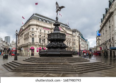 Piccadilly Circus, London, England - March 30, 2020: Deserted Piccadilly Circus, and the rest of the UK on lockdown as the world try to tackle the corona virus pandemic.