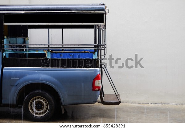 Pick up of blue taxi truck for transportation\
service in countryside of\
Thailand