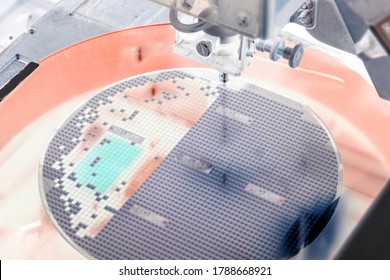 Pick up silicon die in silicon wafer in die attach machine in semiconductor manufacturing/negative color 