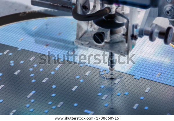 Pick up\
silicon die in silicon wafer in die attach machine in semiconductor\
manufacturing/negative color\
