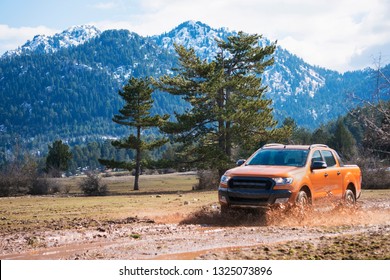 Pick Up Truck Is Passing In The Mud