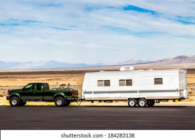 Pick Up Truck  With RV Travel Trailer On The Road