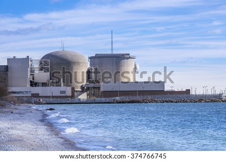 Pickering Nuclear Generating Plant, as seen from the shore of Lake Ontario, is located in  Pickering a city just outside of Toronto Canada.