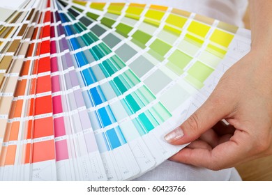 Picking The Right Paint - Woman Hand With Color Sample Chart