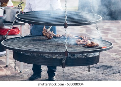Pickled chicken fried on a large barbecue