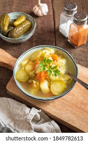 Pickled Cucumber Soup With Vegetables On A Wooden Background