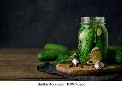 Pickled cucumbers with herbs and spices 