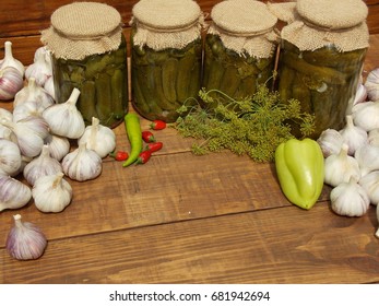 pickled cucumbers in jars on the table garlic pepper