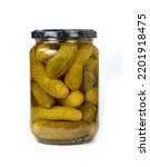 Pickled cucumbers in a transparent jar isolated on white background