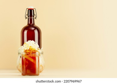 Pickled Or Fermented Vegetables. Sauerkraut, Lecho In Glass Jars And Bottle Of Home Made Beer On Light Background With Copy Space. Home Food Preserving Or Canning. Autumn Food And Oktoberfest Concept