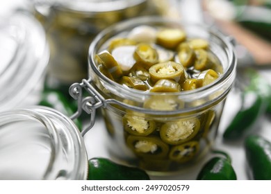 Pickled green mexican jalapeno hot peppers in a mason jar close up. Food photography - Powered by Shutterstock