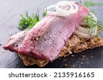 pickled herring fillet with onions