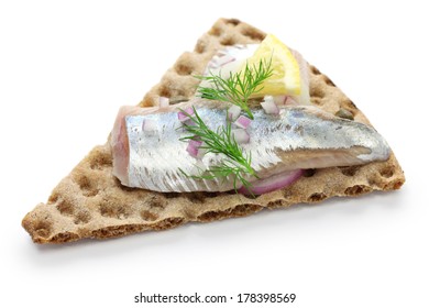 pickled herring on crisp bread, cold appetizer