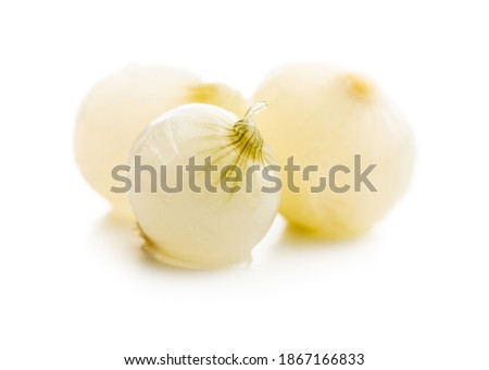 Pickled mini baby onions isolated on white background.