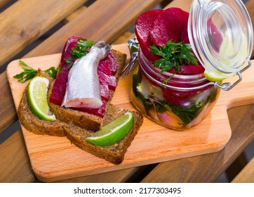 Pickled Poutassou In Homemade Marinade Of Olive Oil And Lime Juice With Spices, Onion And Beet