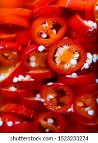 Pickled Red Jalapeno (Capsicum Annum) Peppers Inside A Jar. The Jalapenos Are Chopped. 