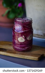 Pickled Red Onions In A Glass Jar