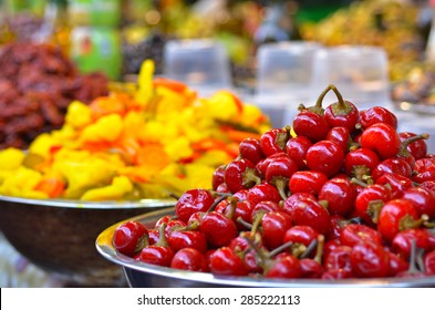 Pickled vegetables, tomatoes on display in food market in Tel Aviv, Israel. Food background and texture