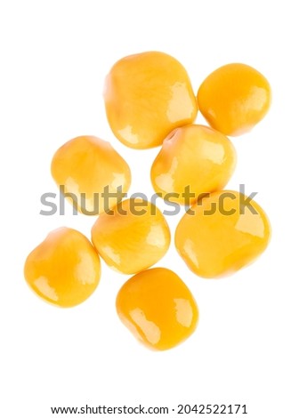 Pickled yellow lupine beans isolated on white background. Tournus, preserved lupinus. Top view.