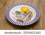 pickled young herring fillet ( matjes ) with boiled potato