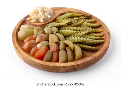 Pickles in a wooden plate. Banquet festive dishes. Gourmet restaurant menu. White background. - Shutterstock ID 1729705342