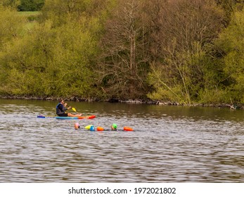 Pickmere Lake, Pickmere, Knutsford, Cheshire, UK. 24th April 2021. Open Water Swimmer Group Taking Part In Organised Open Water Swimming Training, Pickmere, Knutsford, Cheshire, Uk