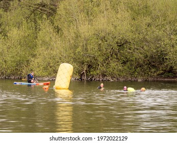 Pickmere Lake, Pickmere, Knutsford, Cheshire, UK. 24th April 2021. Open Water Swimmer Group Taking Part In Organised Open Water Swimming Training, Pickmere, Knutsford, Cheshire, Uk