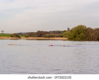 Pickmere Lake, Pickmere, Knutsford, Cheshire, UK. 24th April 2021. Open Water Swimmer Group Taking Part In Organised Open Water Swimming Training, Pickmere, Knutsford, Cheshire, Uk